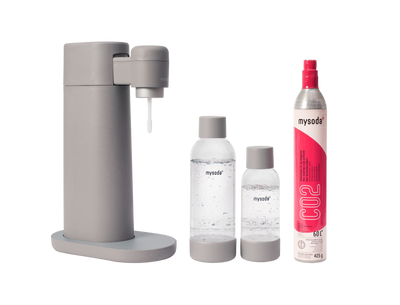 A dove Toby sparkling water maker with bottle